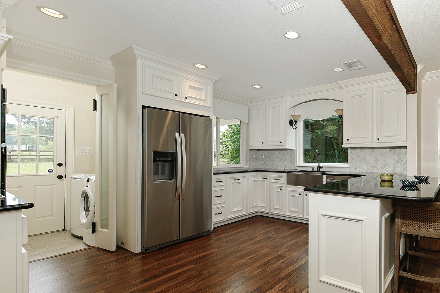 Kitchen with stainless appliances and farmhouse sink