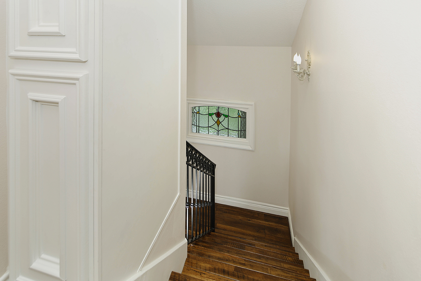 Staircase with stained glass window