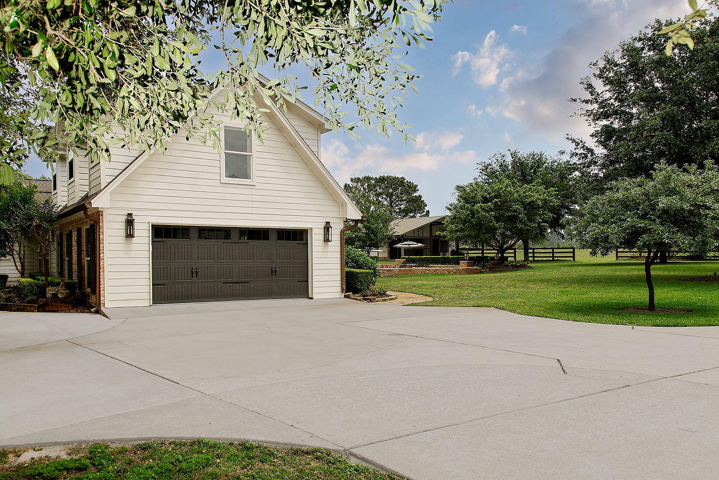 Carriage house with two-car garage and pasture views