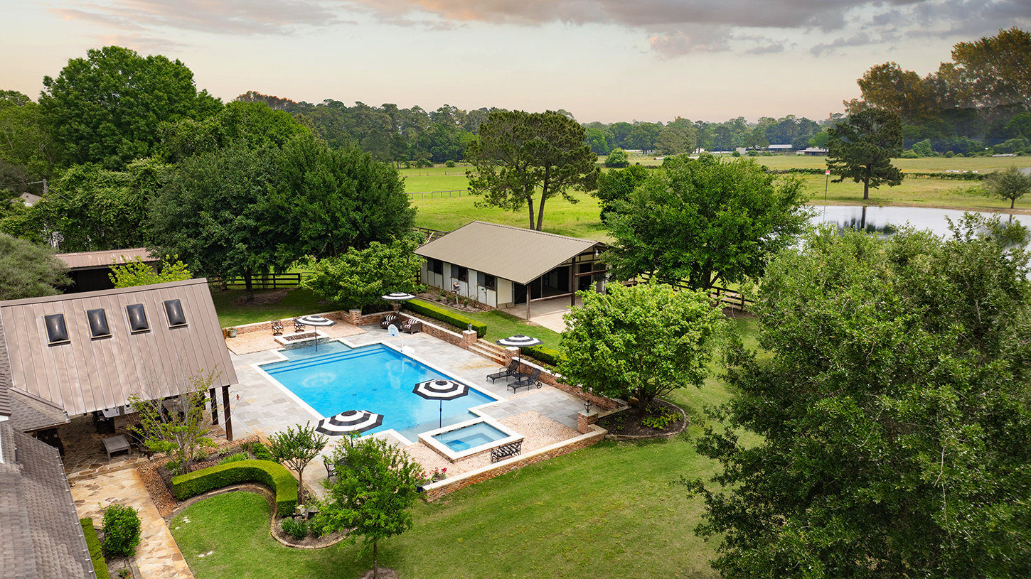 Drone view over the pool pavilion and pond beyond