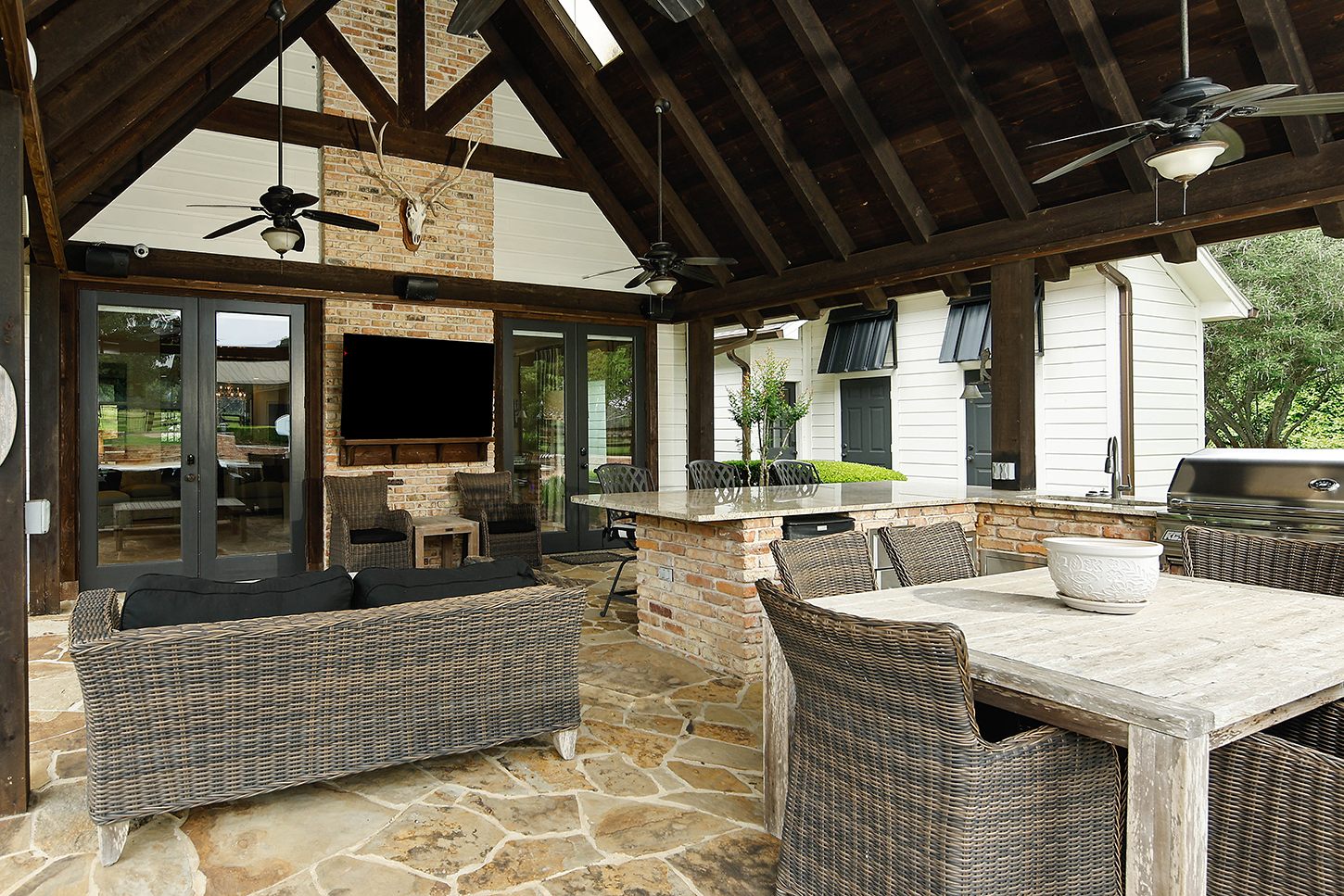 Covered pavilion lounge with fireplace and dining