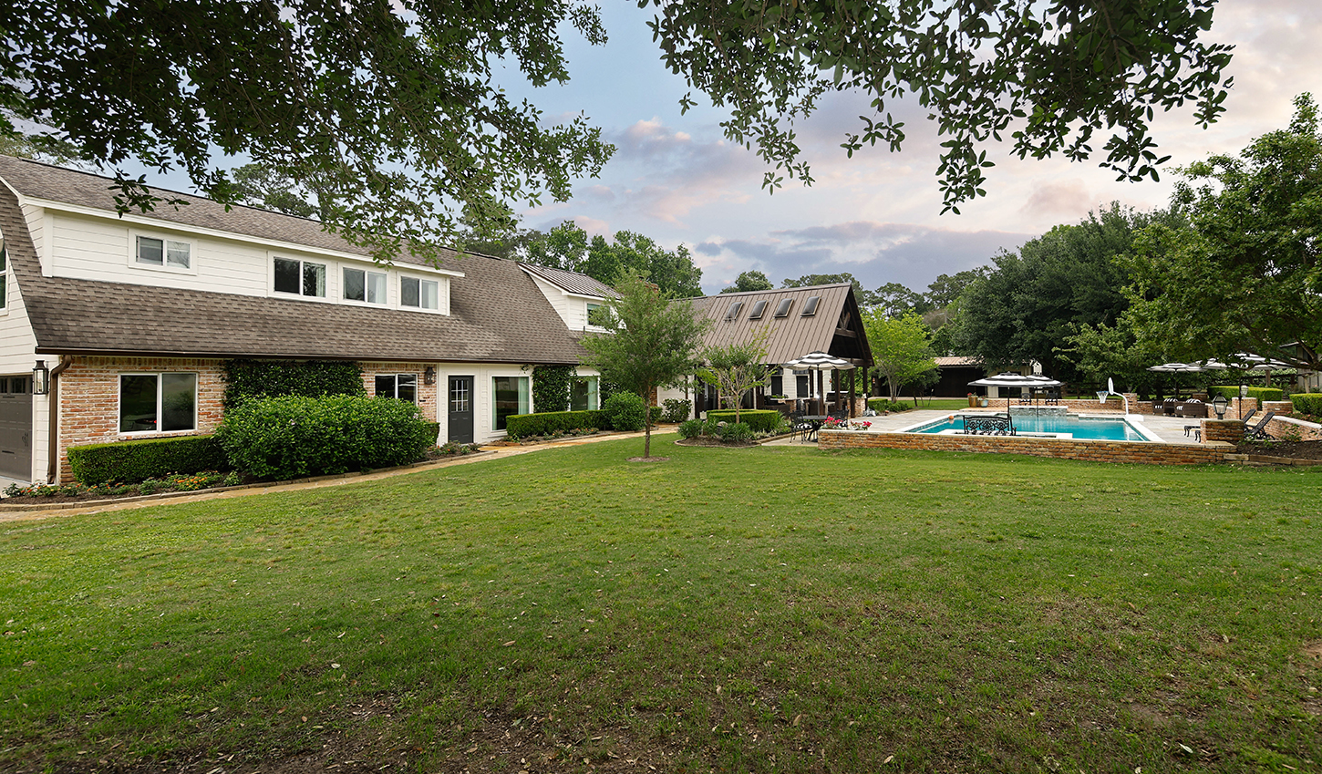 Rear lawn looking toward the pool and pavilion