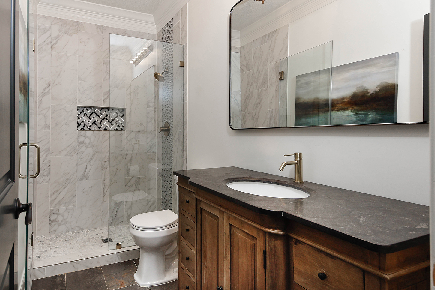 Marble bath with walk-in shower and stone vanity