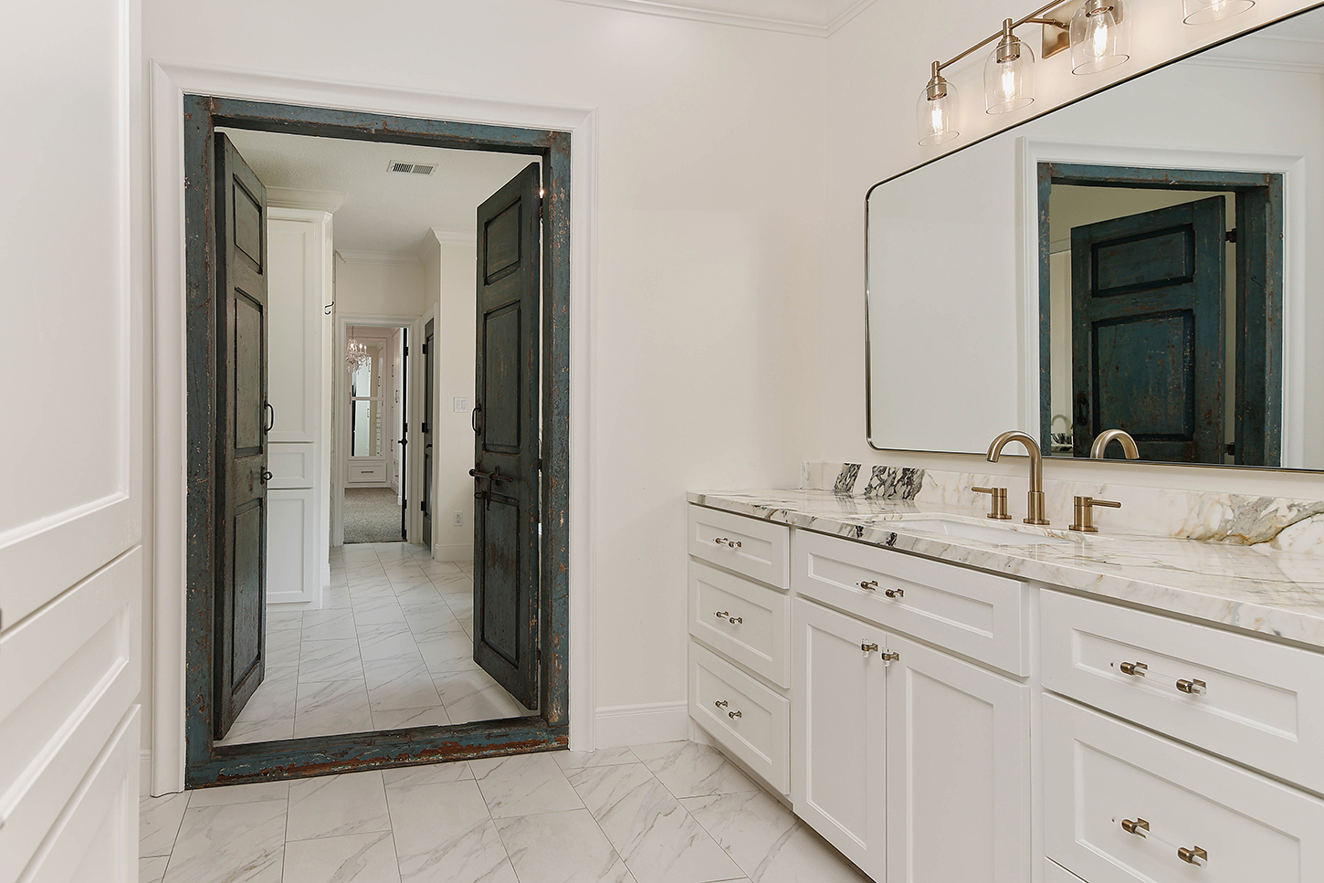 Primary bath double vanity with marble countertops