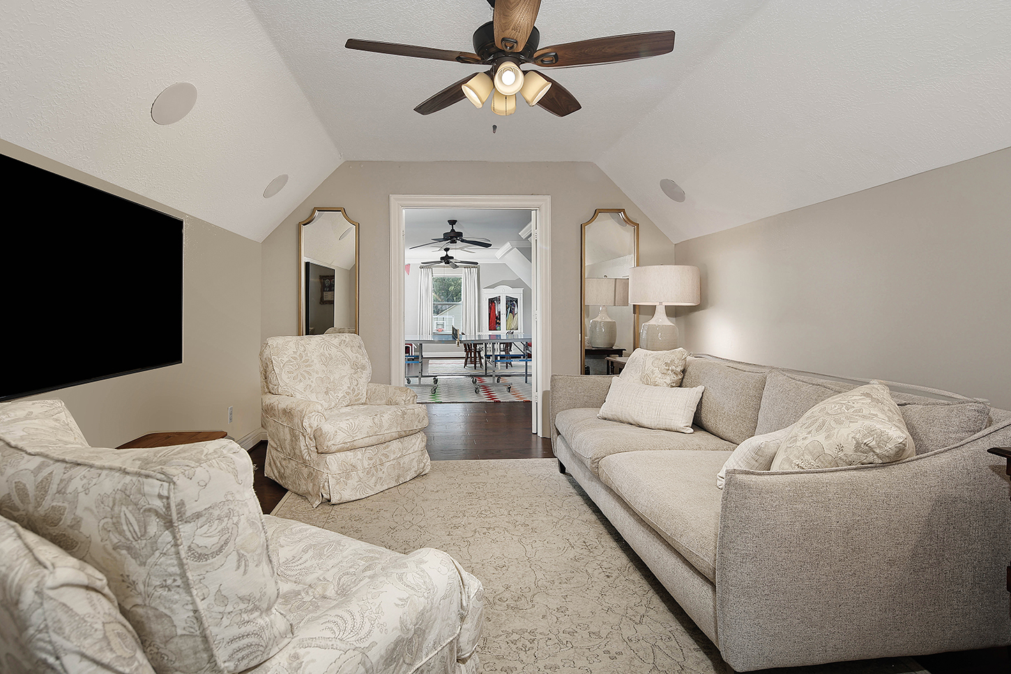 Upstairs bonus lounge with vaulted ceiling