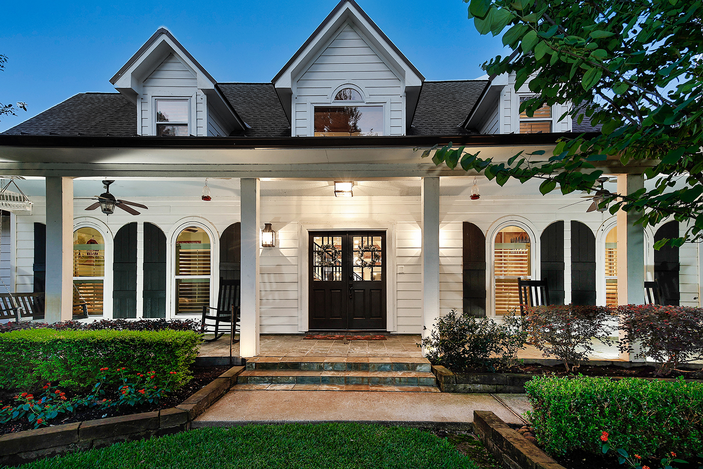 Twilight close-up of the main house front porch and entry
