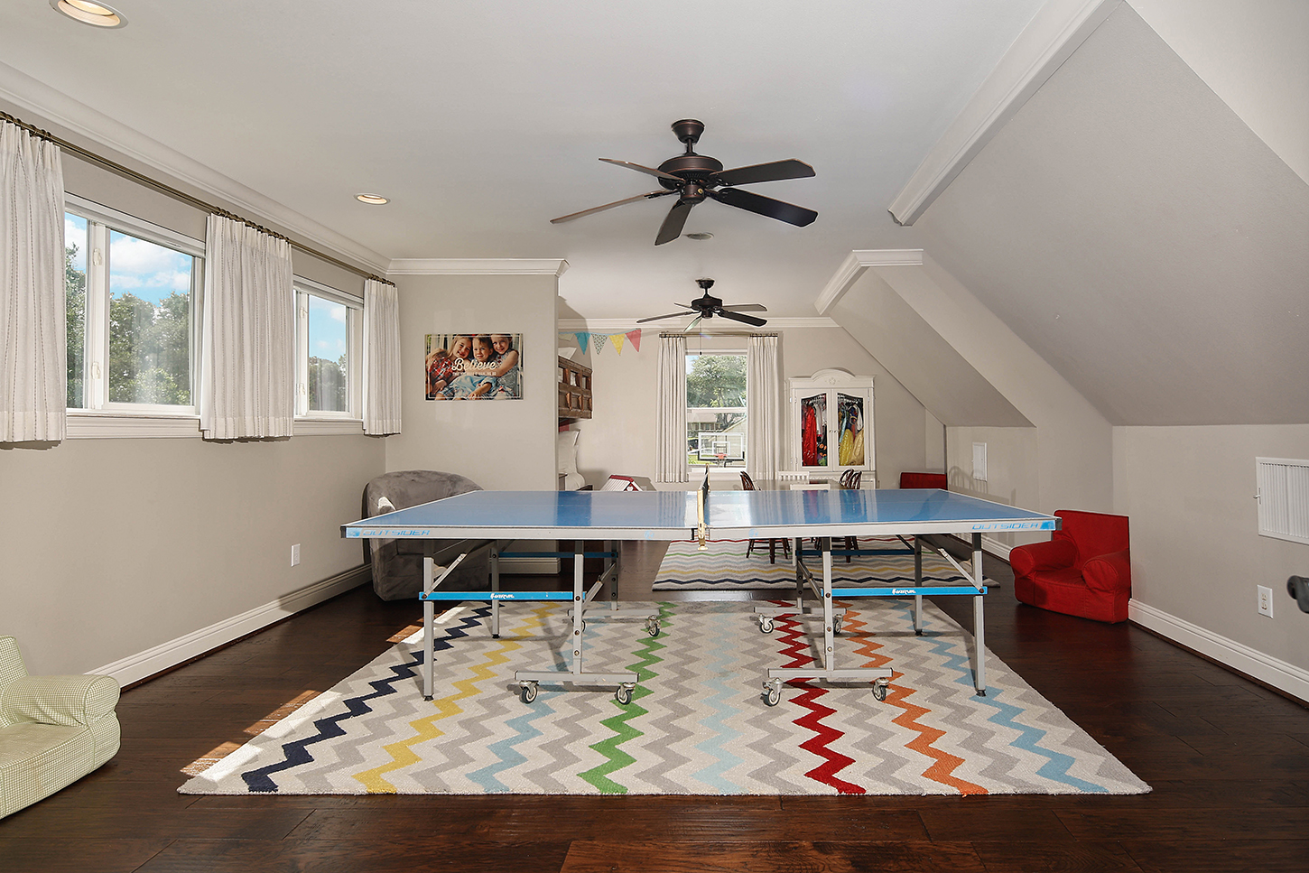 Game room with ping pong table and play area