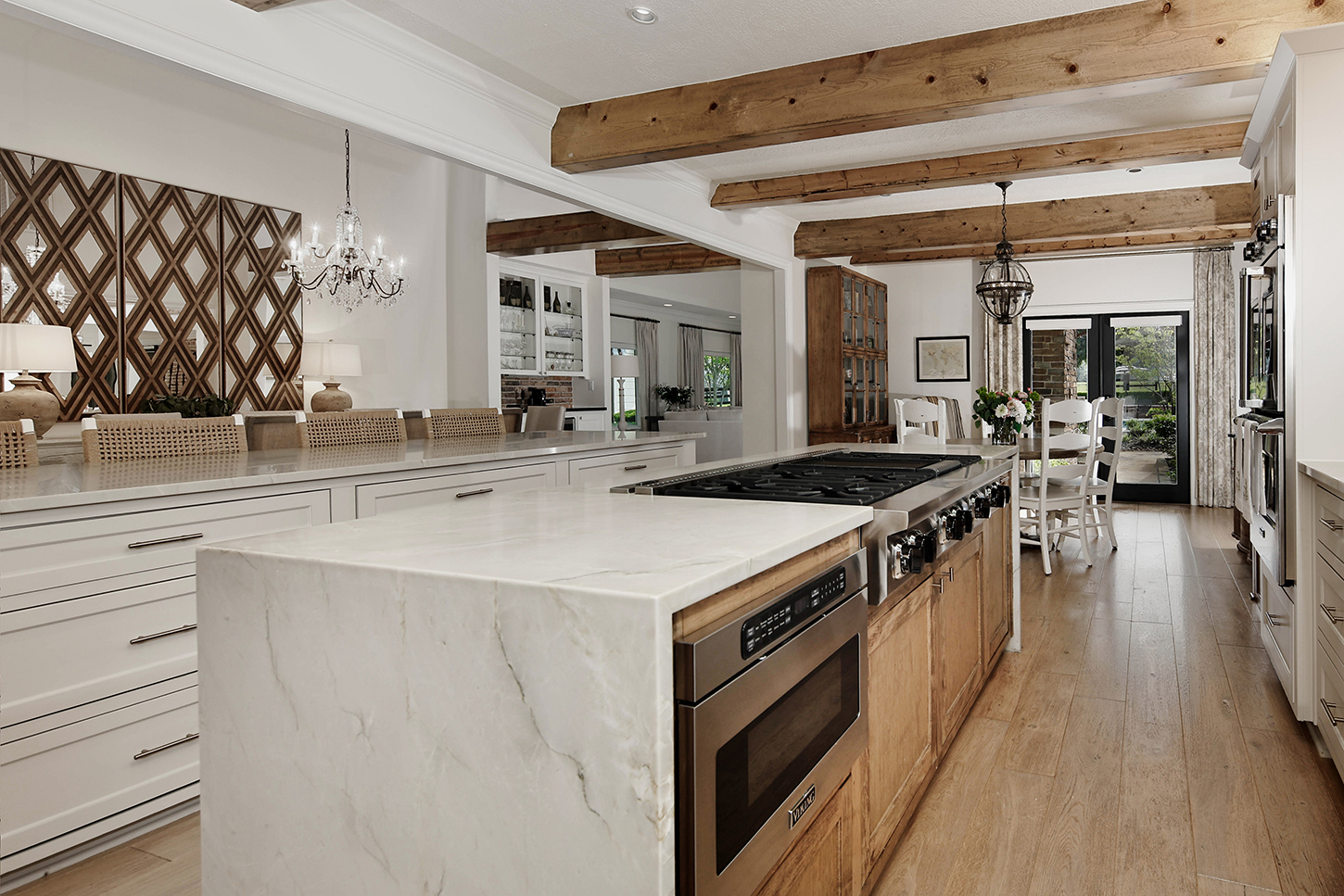 Wide view of kitchen with reclaimed beams