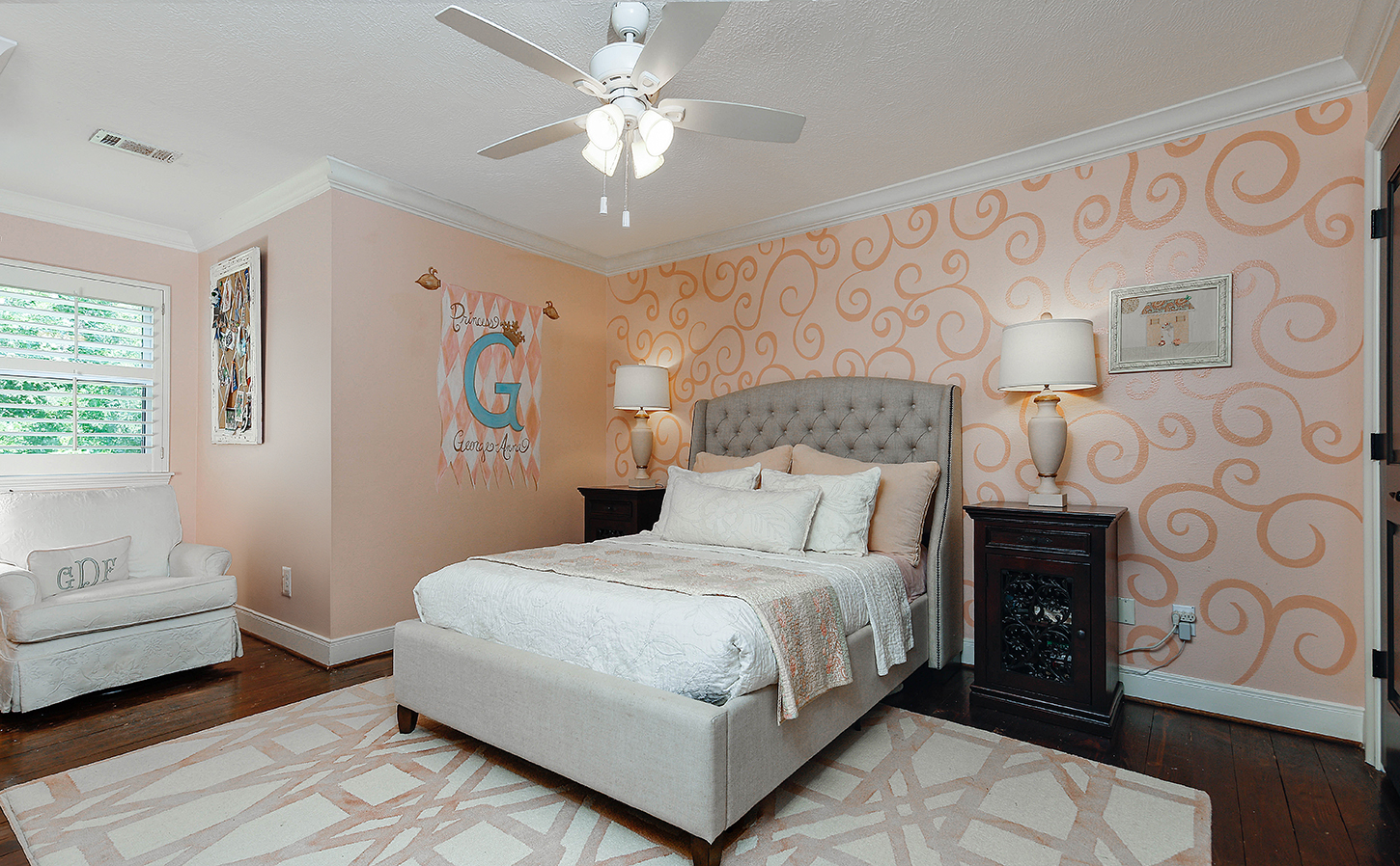 Soft pink bedroom with upholstered bed